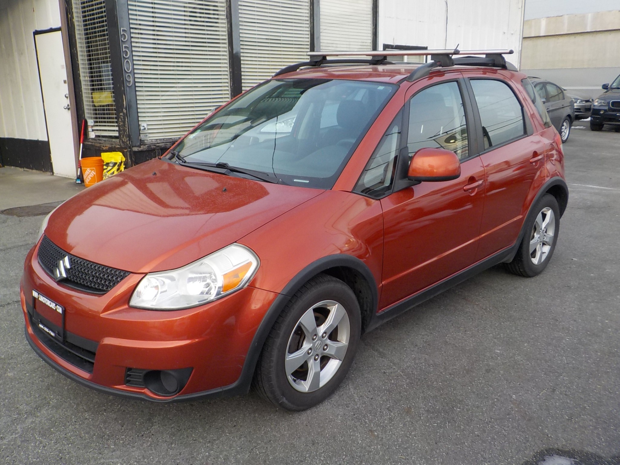 Voxcar SUZUKI SX4 HATCHBACK in Metallic Orange, VANCOUVER