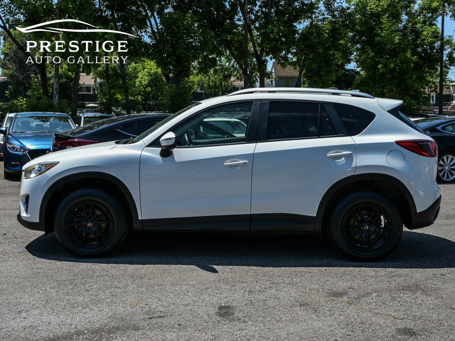 /prestigeautogallery/2016-Mazda-CX-5-049912135575579386.jpg
