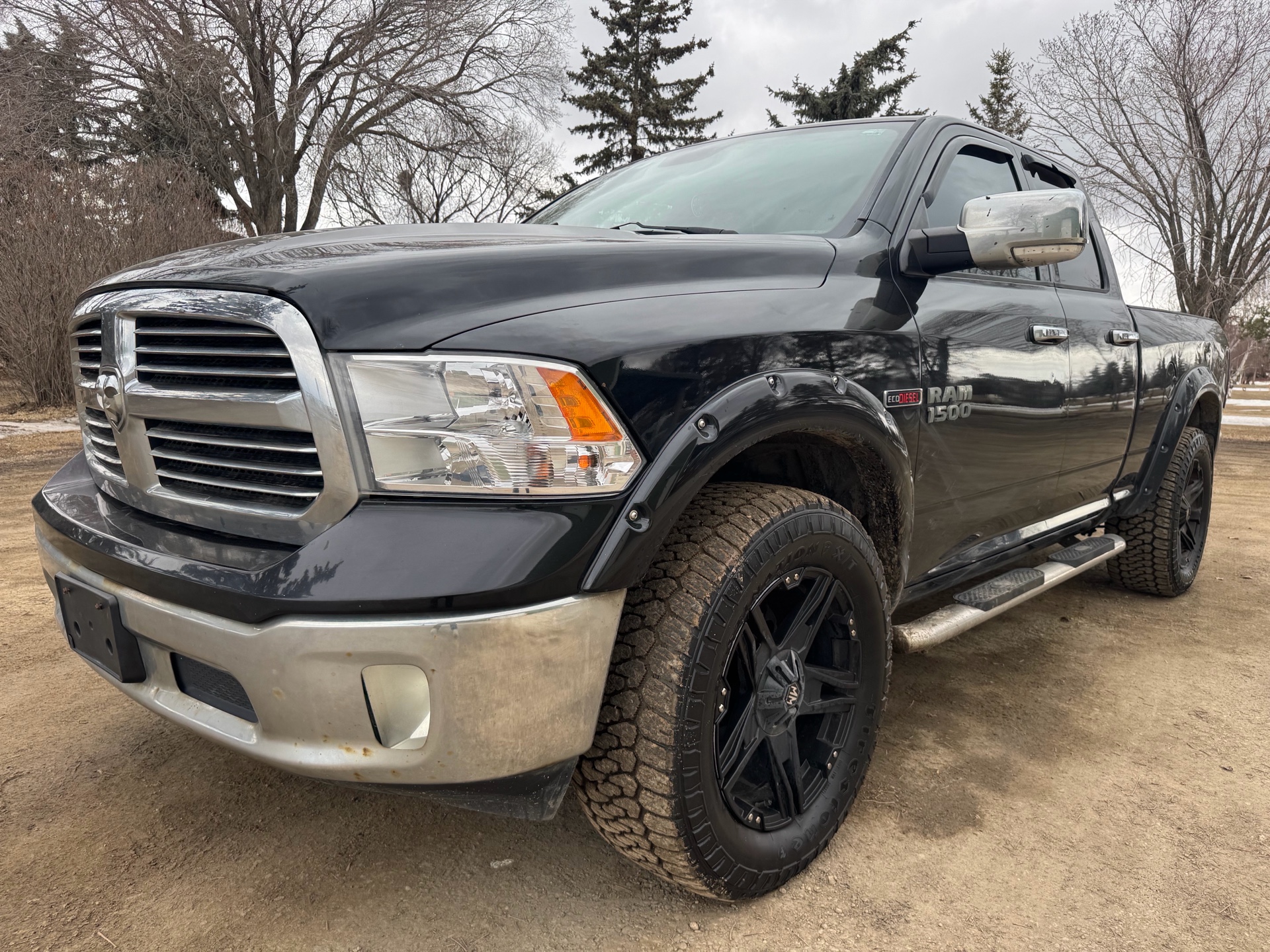 2014 RAM 1500 4WD Quad Cab 140.5" SLT